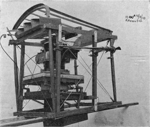 L B camera with 20 inch lens, mounted on bell crank suspension in skeleton fuselage.