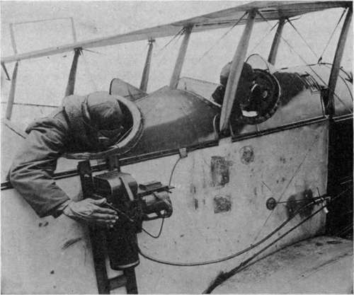 L camera mounted outside the fuselage. Observer using exposure plunger, pilot using Bowden wire release.