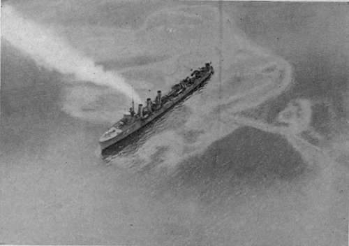 The submarine destroyed. Destroyer on tell tale oil patch. British official photographs.