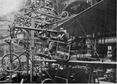 A Voisin biplane equipped with a Hotchkiss machine gun, exhibited at the 1910 Salon de l'Aronautique, Paris.