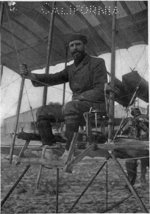 Henry Farman seated in his biplane.